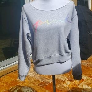 Woman's Pink  off the shoulder sweatshirt.